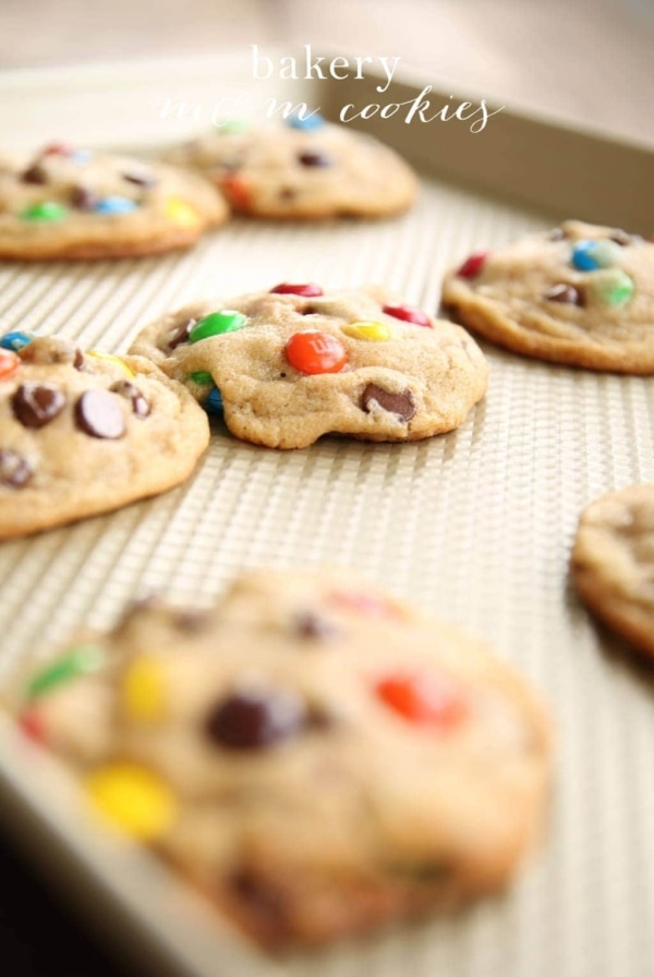 M and M cookies on a cooling rack.