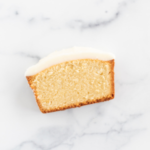 Pound cake slice covered in a pound cake glaze.