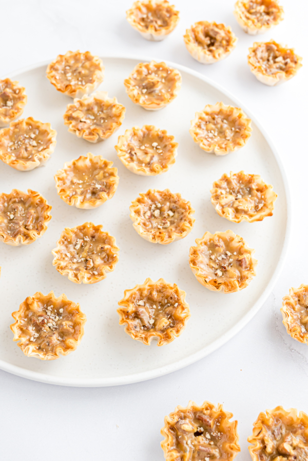 A plate with Mini Pecan Pie bites on it.