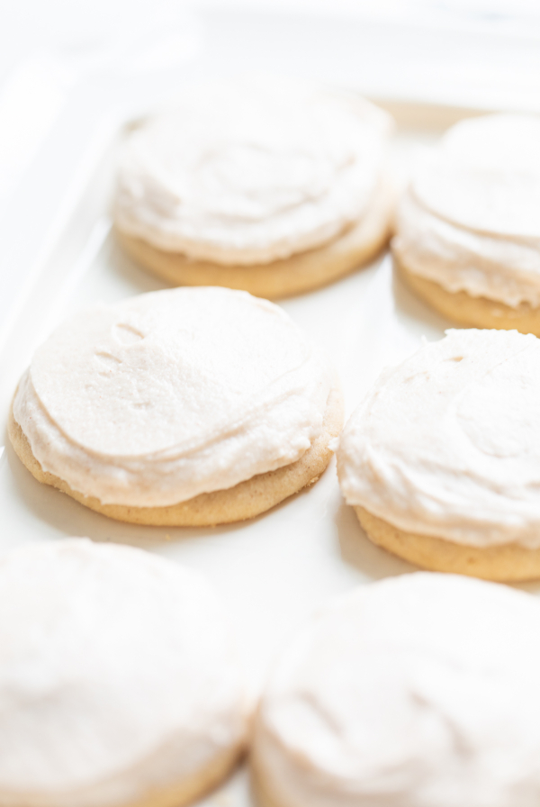 frosted cinnamon sugar cookies on a white platter