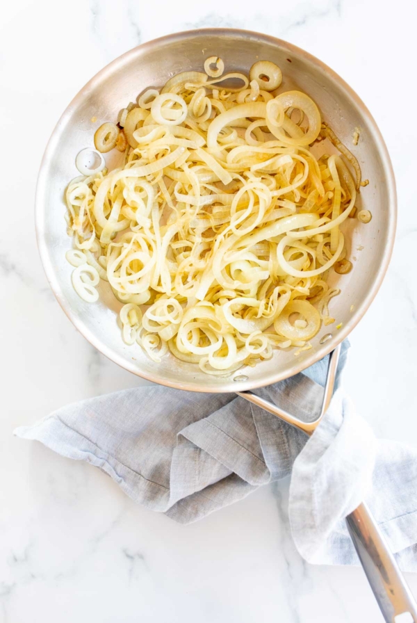 Sliced onions in a pan, for a guide on how to cut an onion.