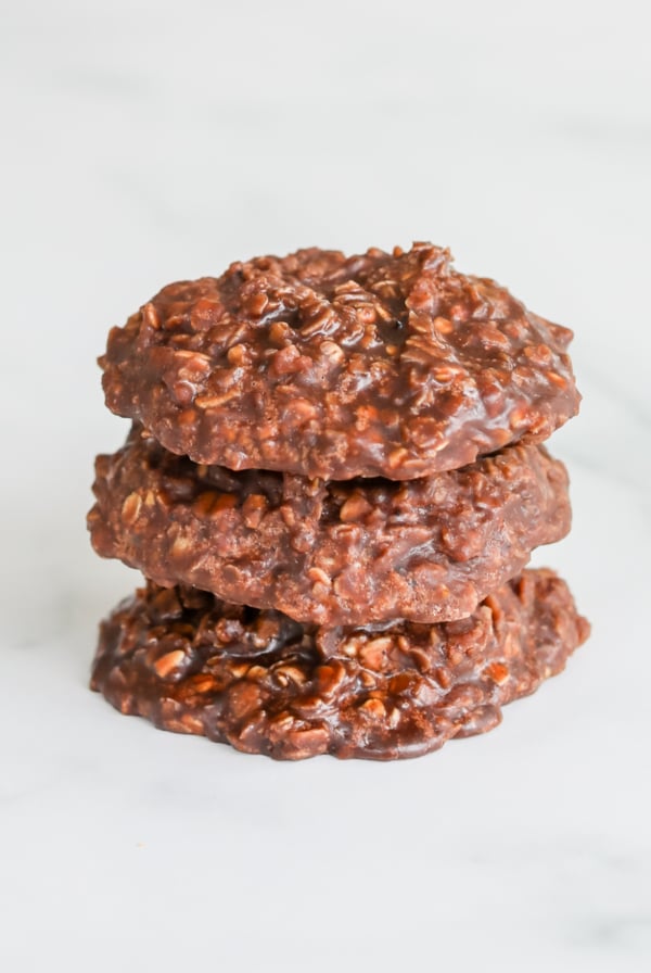 A stack of chocolate no bake desserts on a white surface.