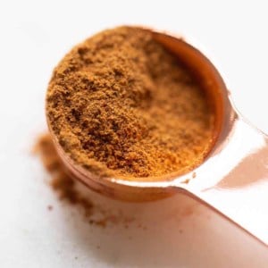 pumpkin pie spice in copper measuring spoon