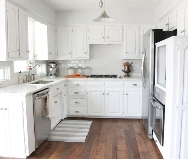 A kitchen with a wood floor